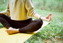 여름철 실내 운동 추천: 집에서 즐기는 운동 루틴 woman in brown long sleeve shirt and black pants sitting on white textile