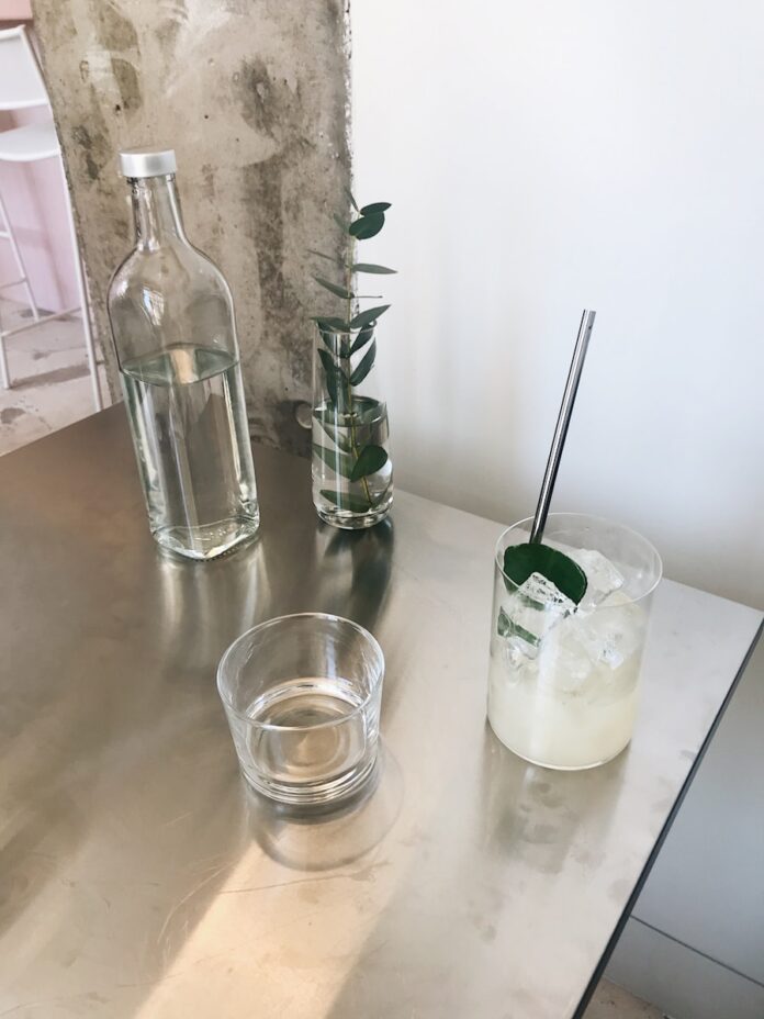 Photo by dasha blankovaya clear drinking glass on table