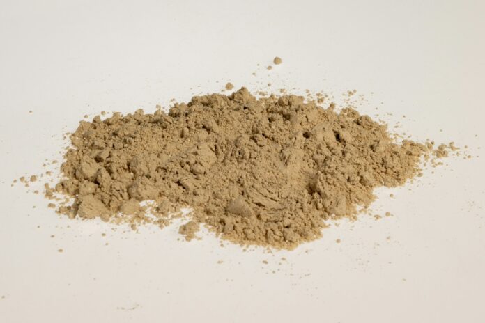 a pile of dirt sitting on top of a white table