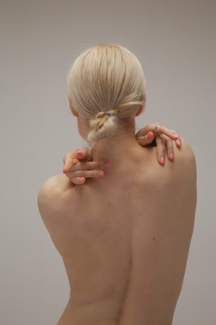 Photo by Klara Kulikova a man with his hands in his hair