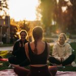 변화하는 여성 건강관리, 일상 속 작은 실천이 큰 변화를 부른다 a group of people sitting on top of a lush green field